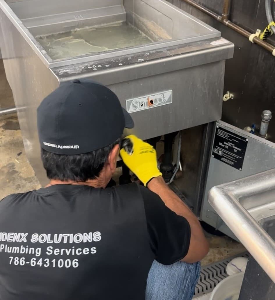 Plumber in Miami Dade working on a project